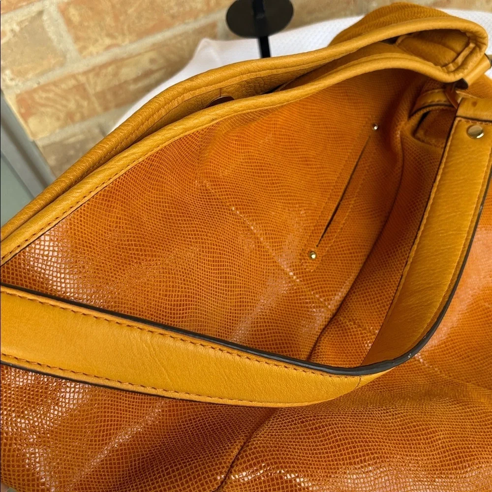 B. Makowsky Orange Hobo Bag